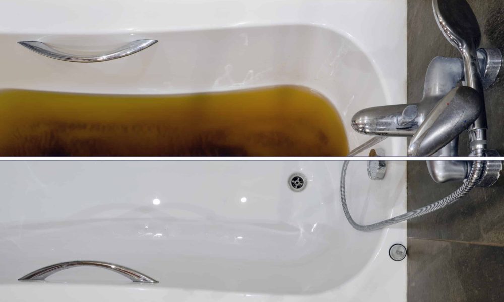 A bathtub filled with dirty water due to a clogged sewer pipe before and after cleaning the drain, close-up