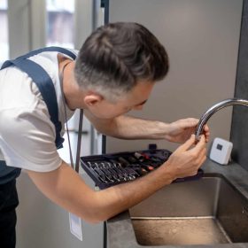man-spinning-faucet-aerator-on-spout-pipe.jpg man-spinning-faucet-aerator-on-spout-pipe.jpg
